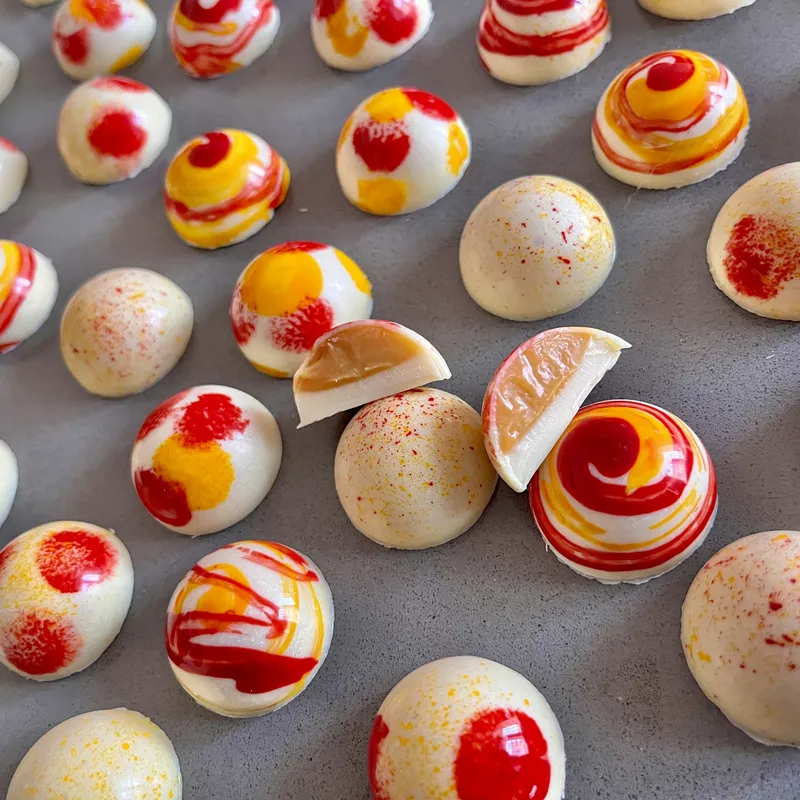 Exotic caramel with colorful white chocolate coating